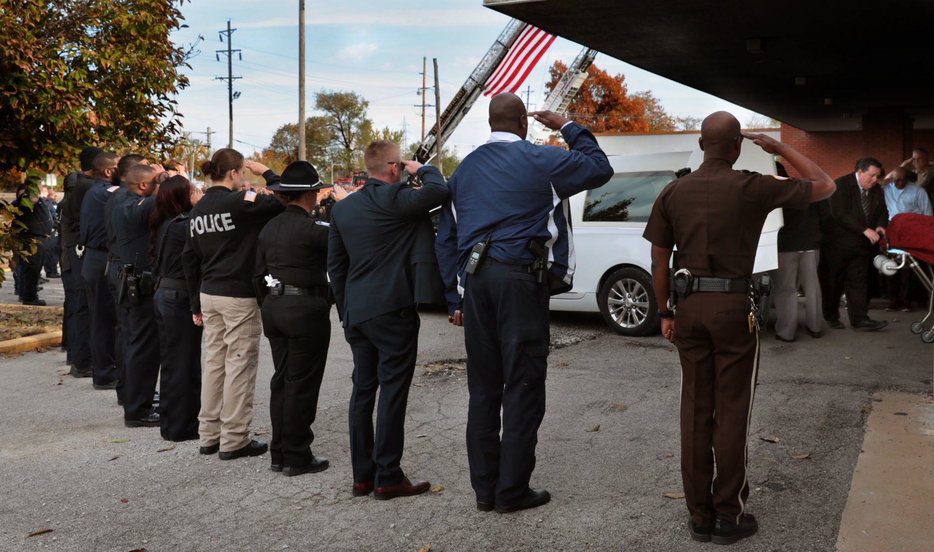 Police officer's body escorted to funeral home